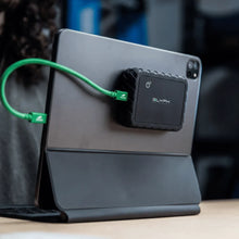 Load image into Gallery viewer, GLYPH Atom EX80 magnetically mounted behind a tablet