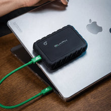 Load image into Gallery viewer, GLYPH Atom EX80 portable SSD positioned on a laptop