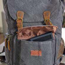 Load image into Gallery viewer, Oyen Digital Helix Dura portable SSD stored in a backpack