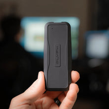 Load image into Gallery viewer, Compact GLYPH Atom EV portable SSD held in one hand