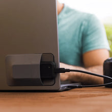Load image into Gallery viewer, GLYPH Atom EV SSD mounted behind a laptop display