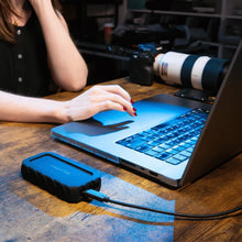Load image into Gallery viewer, GLYPH Atom EX20 portable SSD connected beside a laptop