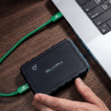 Load image into Gallery viewer, GLYPH Atom EX80 portable SSD connected to a laptop