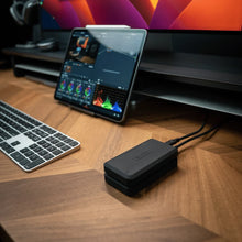 Load image into Gallery viewer, Two GLYPH Atom PRO portable SSDs at a video editing desk