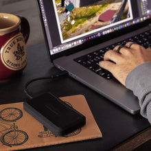 Load image into Gallery viewer, GLYPH Atom PRO V2 connected to a laptop during a creative workflow