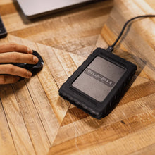 Load image into Gallery viewer, Blackbox Plus USB-C drive connected on a wooden desktop