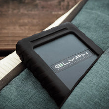 Load image into Gallery viewer, GLYPH Blackbox Plus portable drive stored in a travel bag