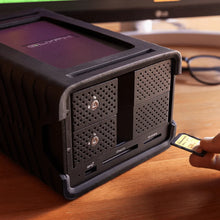 Load image into Gallery viewer, UHS-II SD card being inserted into GLYPH Blackbox PRO RAID