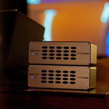 Load image into Gallery viewer, Two GLYPH StudioRAID desktop drives in a recording studio