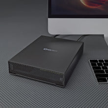 Load image into Gallery viewer, Oyen Digital HDX Pro C desktop hard drive beside a studio computer