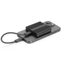 Load image into Gallery viewer, OYEN DIGITAL Helix MAG40 SSD magnetically mounted to an iPhone